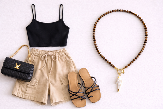 Black crop top, beige shorts, black sandals, black handbag, and wooden beaded necklace on a white background. Necklace made by Golden Touch Accessories