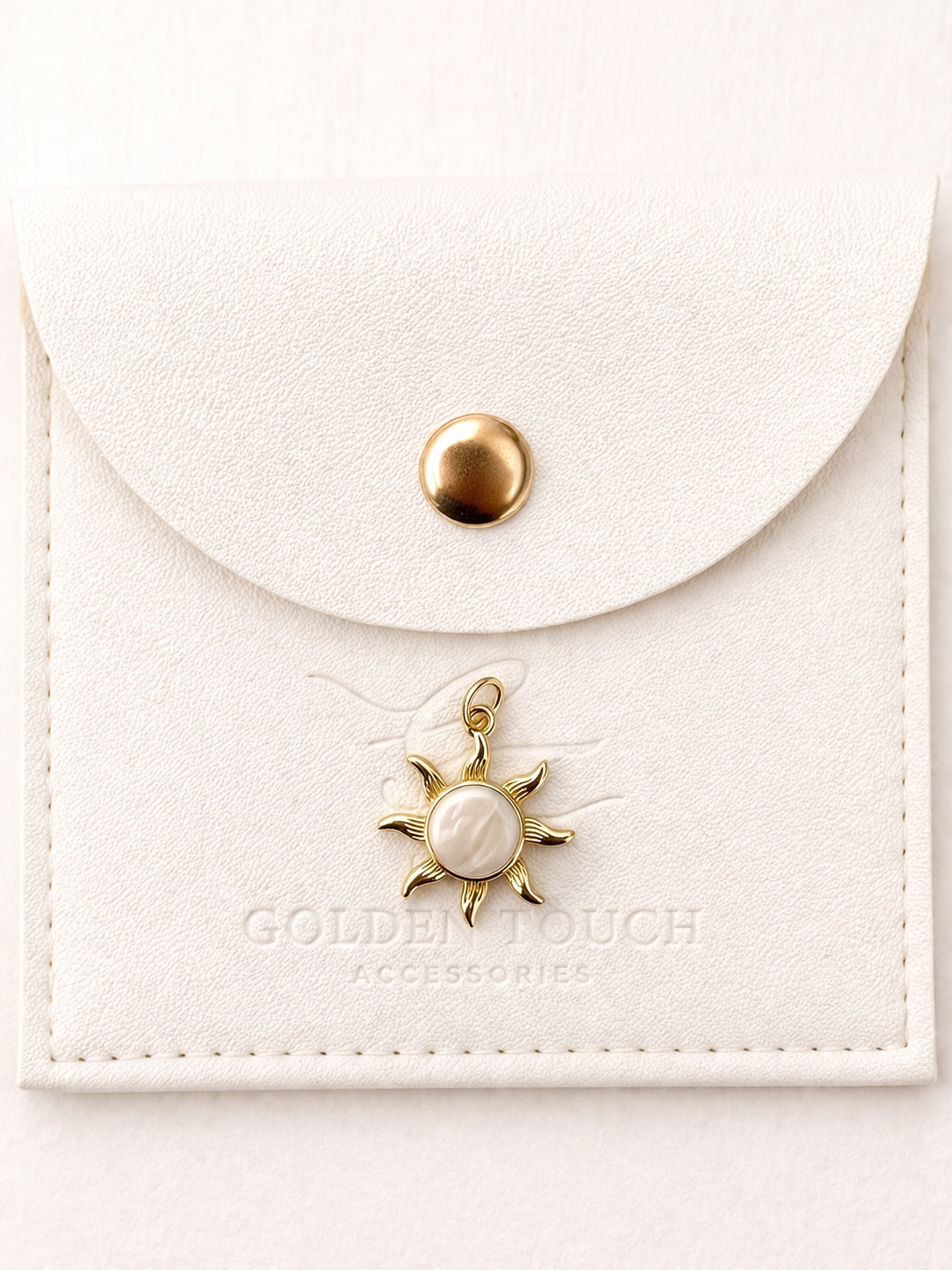 Gold sun charmp pendant with middle cream white detail