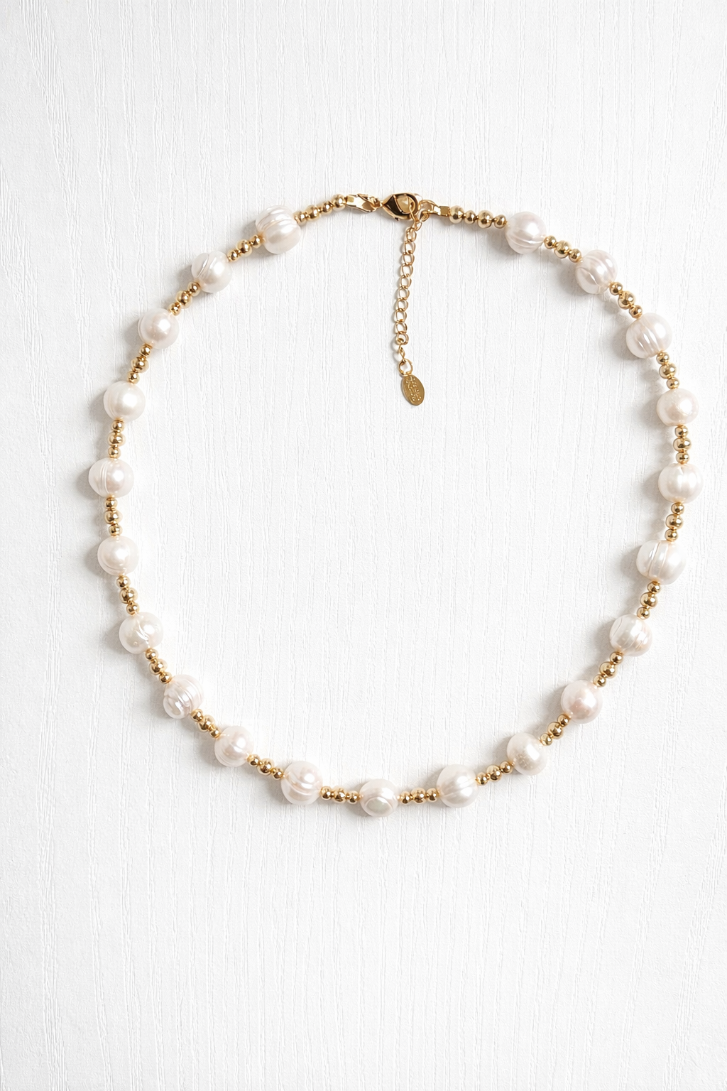     Elegant pearl necklace layered look