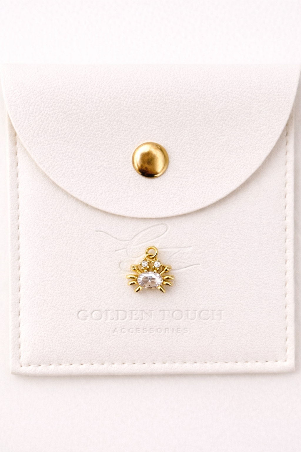 Tiny gold crab with middle zirconia crystal charm pendant