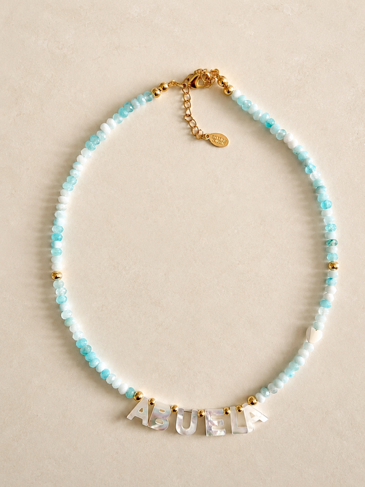 Turquoise agate beads Necklace with 'ABUELA' LETTERS on a beige background