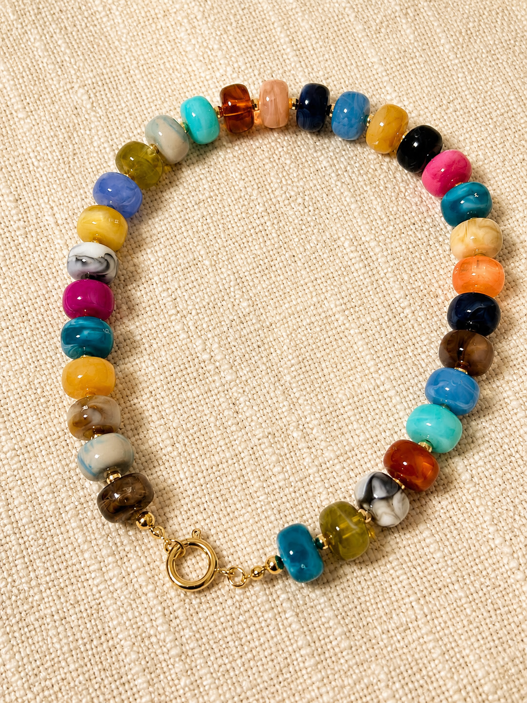 The Riviera Beaded Necklace featuring colorful premium acrylic beads and a front toggle clasp inspired by Mediterranean summer style 