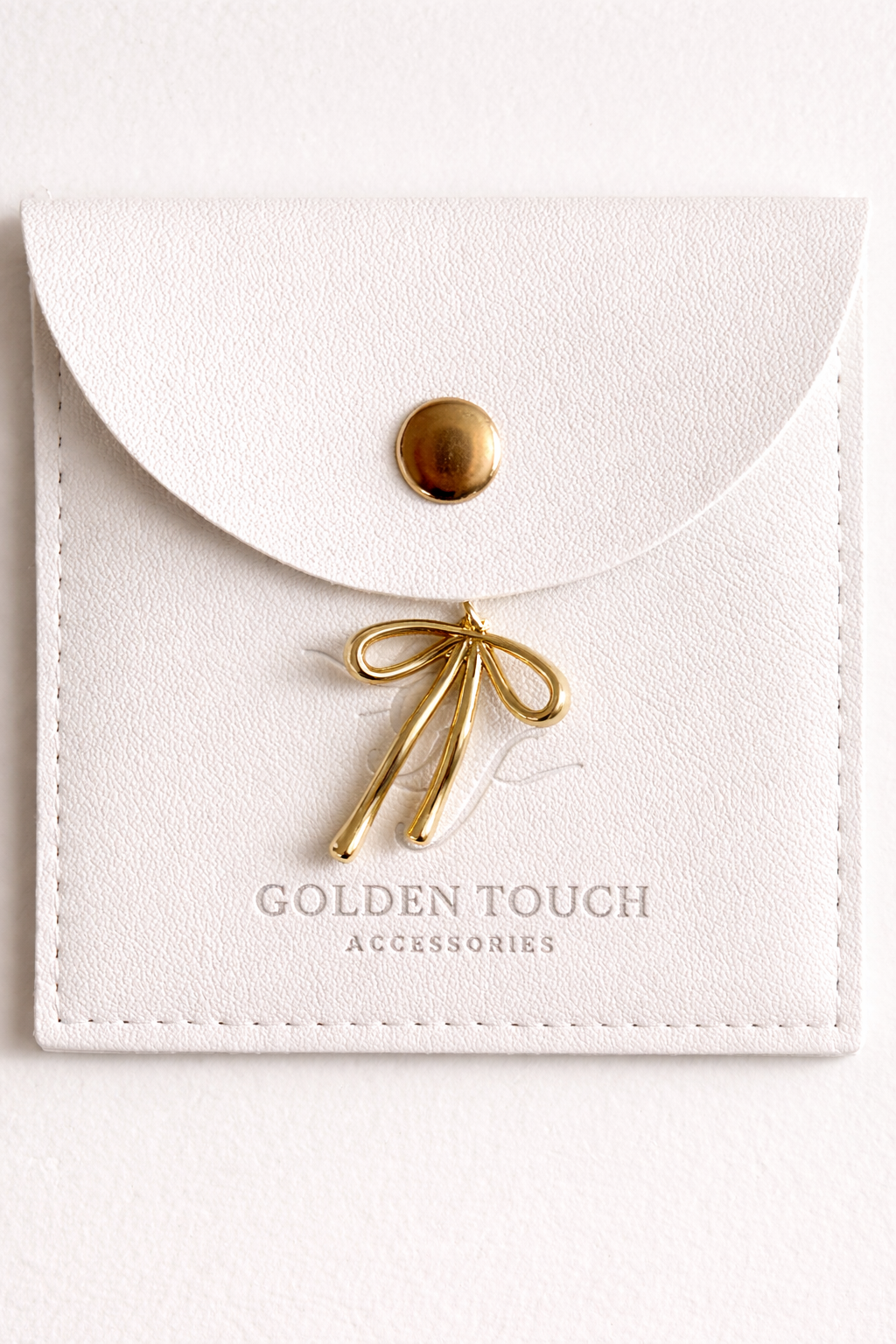 Gold bow charm