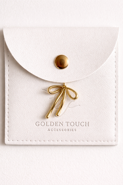 Gold bow charm