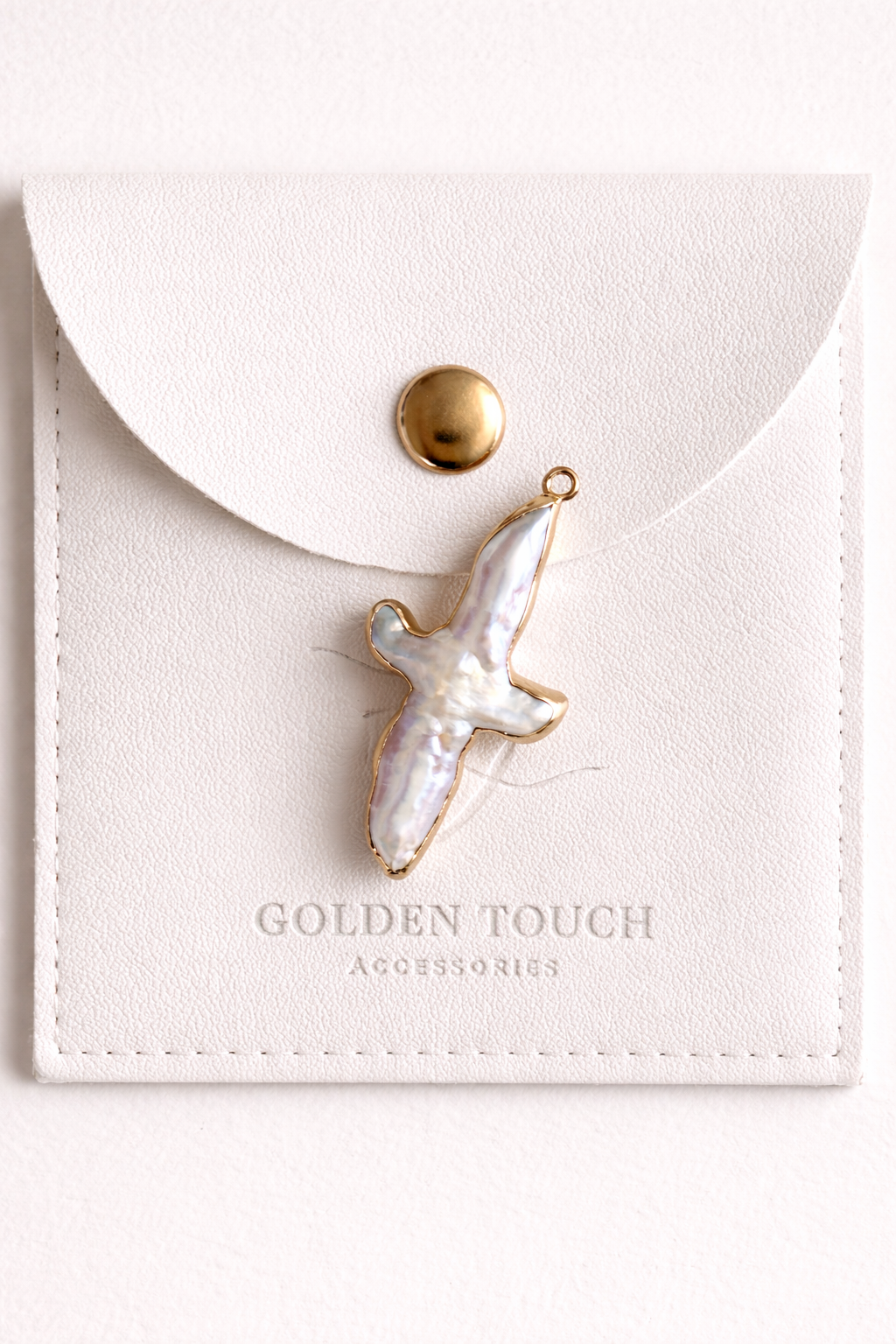 Nacre Cross Medium size on a brand logo pouch golden touch accessories